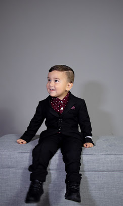 Young client in a suit with a fresh fade by Jay