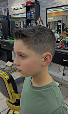 Clean high taper fade on a young client